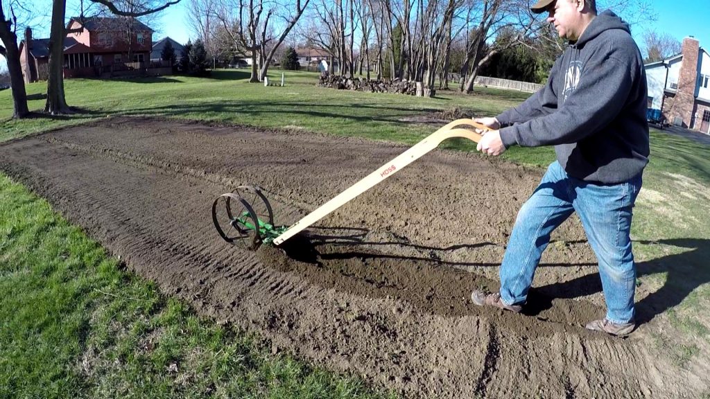 Using the Hoss Wheel Hoe Plow Set to make (and cover) rows Tractor Time with Tim